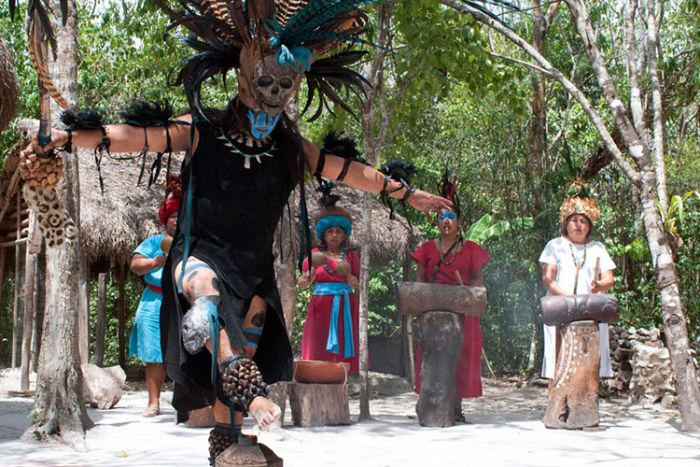 ></center></p><ul><li>Description & Reviews</li><li>Prices & Details</li></ul><p>You'll feel like a real Mayan on this interactive encounter, wandering through a village where the rich local history and culture is laid out before you.</p><p>After being shown how to paint your face in traditional Mayan colors, your guide will take you from workshop to workshop, in thatched palapa huts, where you'll get a true sense of how this mystical civilization lived (and still lives).</p><p>Sip a traditional chocolate drink, invented by Mayans over 2,000 years ago, and recreated by you now by grinding cacao beans with your own hands.</p><p>Prepare corn dough using a centuries-old Mayan technique, and make your own hand-cooked tamales or tortillas with delicious authentic local flavors.</p><p>Following a break for a theatrical performance complete with Mayan smoke and drums, there are more work-shops to enjoy, including seeing how honey is made by stingless Mayan bees, how clothes are made from agave plants and how natural chewing gum is made from ancient trees.</p><p>To round things off you'll be shown how an age-old ball game is played, enjoyed by Mayan thousands of years before NFL or baseball were invented.</p><p>The complete visit lasts about 60 minutes, and you'd never imagine you could pack so much in about the captivating lives of the Mayan people.</p><p>You can stay longer if you wish, and don't miss the little thatched gift store at the end, where you'll find the unique keepsakes and presents you've been searching for all vacation.</p><p>This visit is not offered by cruise lines or package vacation agencies and is not a superficial Mayan theme-park. Instead, you can expect a fun, authentic, hands-on Mayan experience. It's designed by experts in pre-Hispanic Mexico who have a desire to share their knowledge with you.</p><p>You can easily take a taxi or drive a rental car to get there, or it makes a great stop on our Private Taxi Tours and Wheelchair Accessible Tours .</p><p>Don't miss out. Come and learn. Come and be Mayan!</p><h2>Customer Reviews</h2><blockquote>★ ★ ★ ★ ★ 